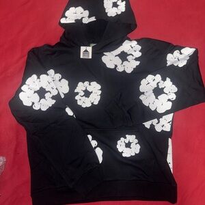 Denim Tear ‘Black’ Hoodie with White Floral Pattern